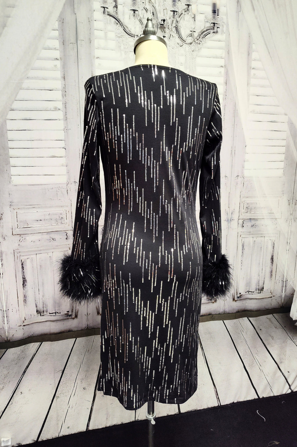 Black knit and silver sequin dress with feather cuffs